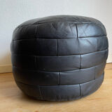 Black patchwork leather pouf from Sède