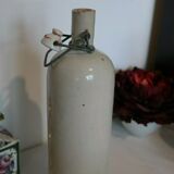 Sandstone bottle and porcelain cap