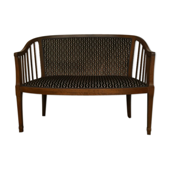 Old wooden and velvet bench