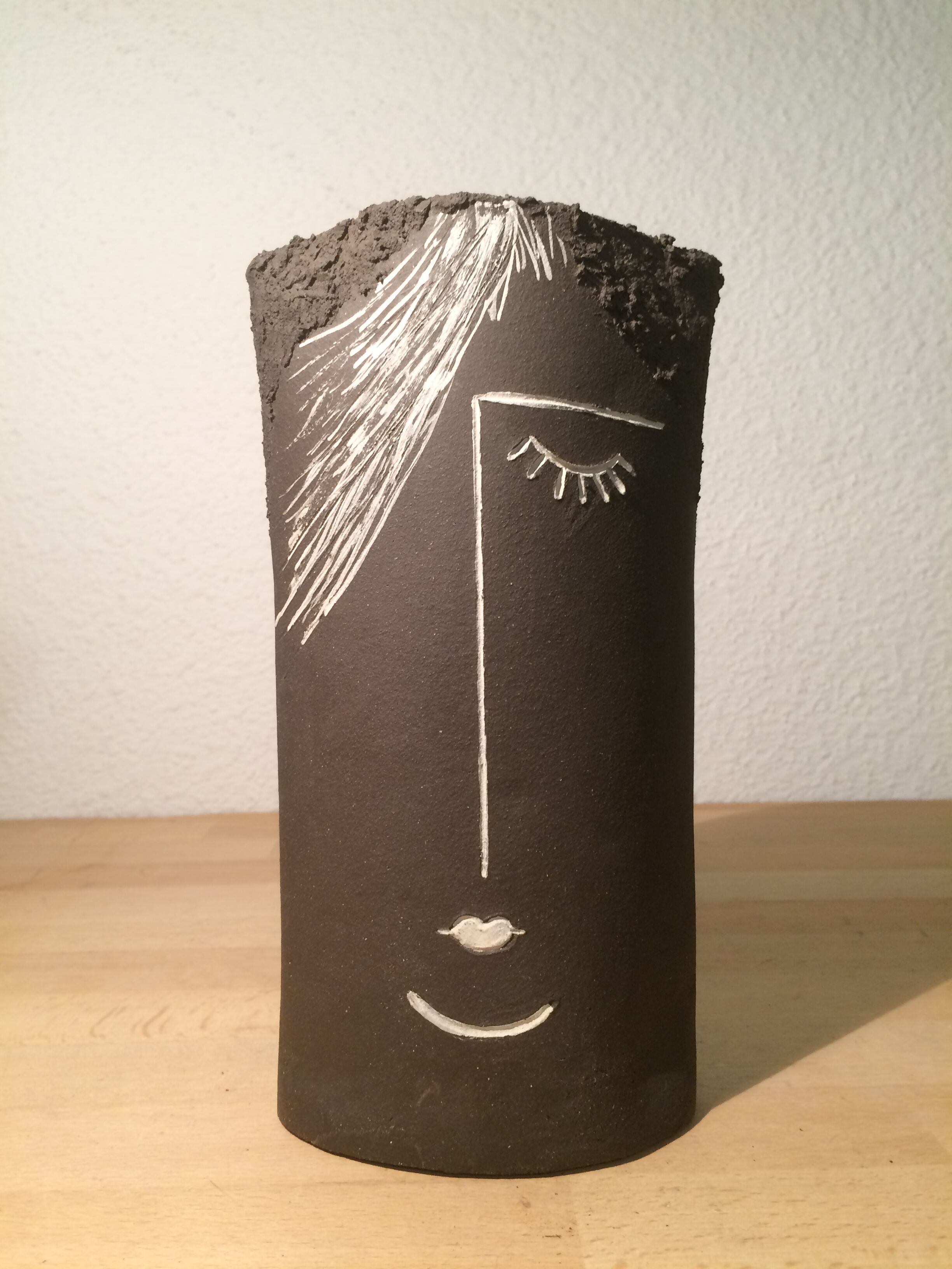 Ceramic vase face, black and white
