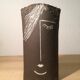 Ceramic vase face, black and white