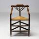 Mid Century Antiques spindle wood chaise with a rush seat.
