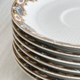 7 Limoges porcelain cups and saucers with gold decoration and floral motif.