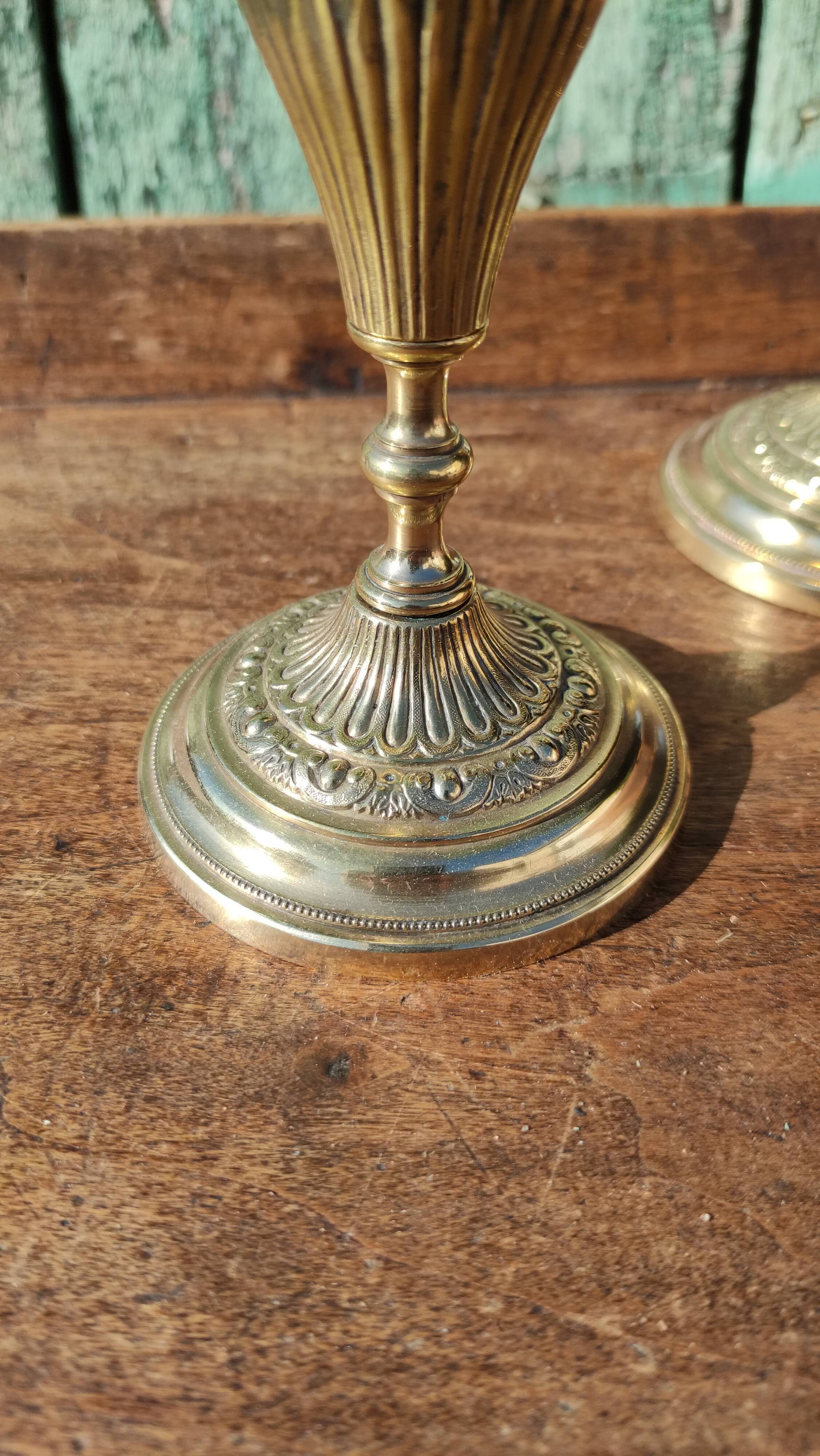 Pair of chiseled brass candle holders