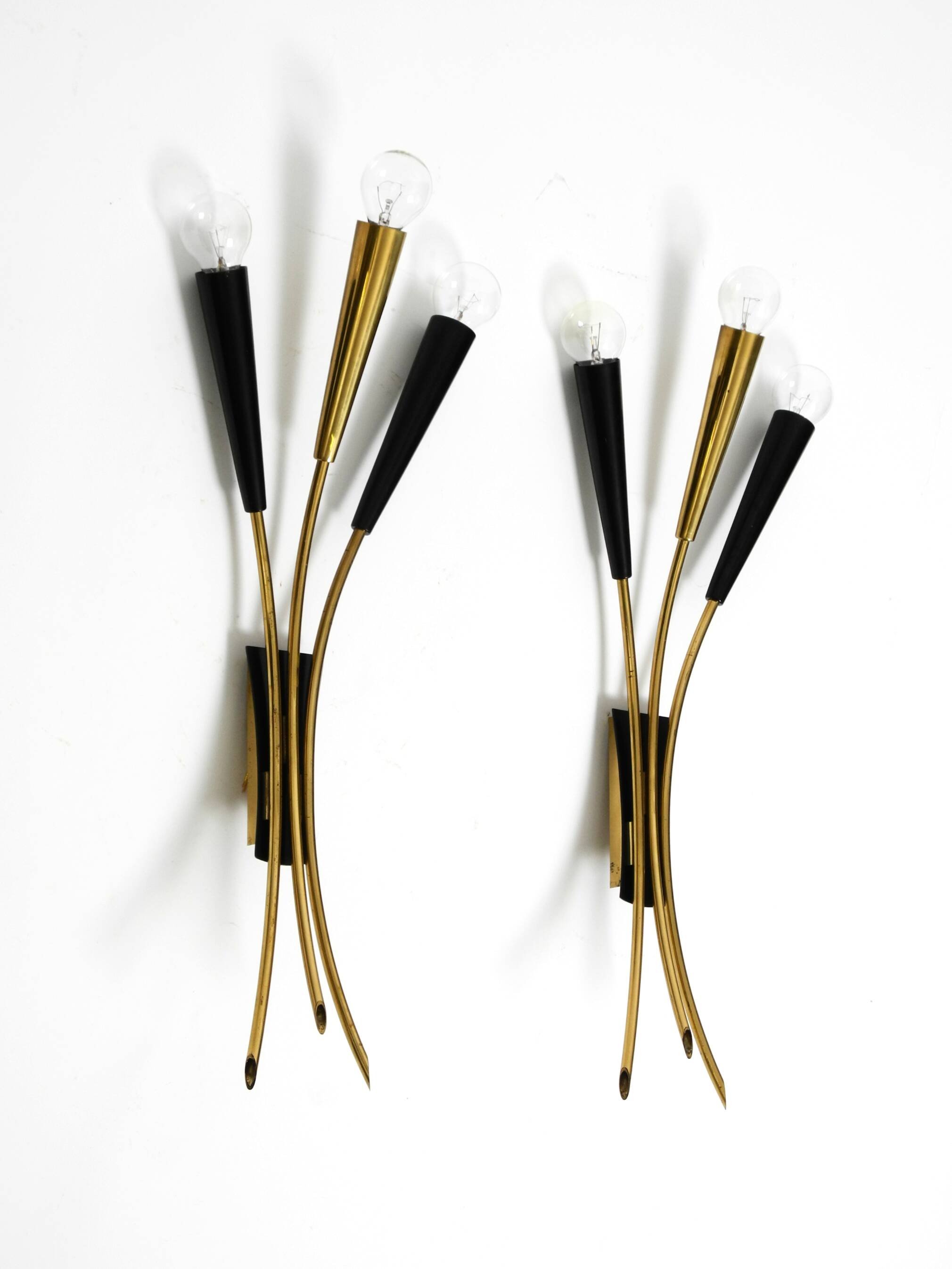 Two beautiful large Mid Century Modern brass 3-light cone wall lamps