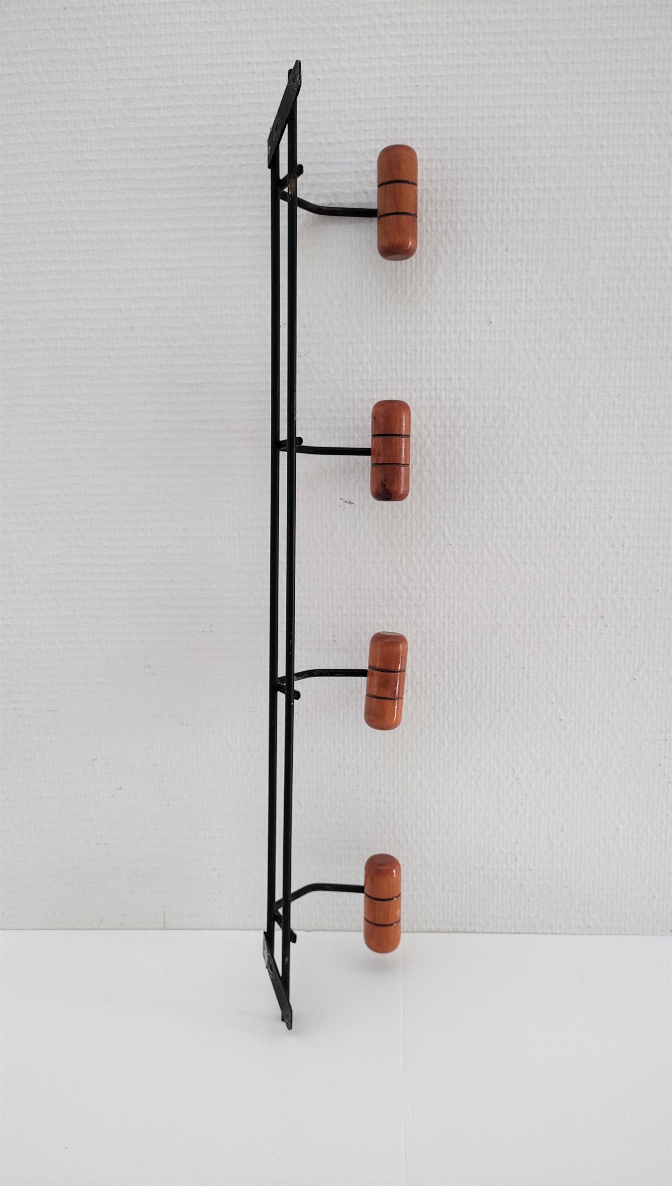 Modernist wall-mounted coat rack in metal and wood, 60s design