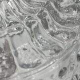 Molded glass ceiling light with spinning top relief