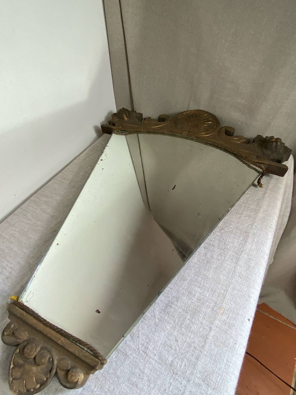 Antique wooden mirror with an unusual shape
