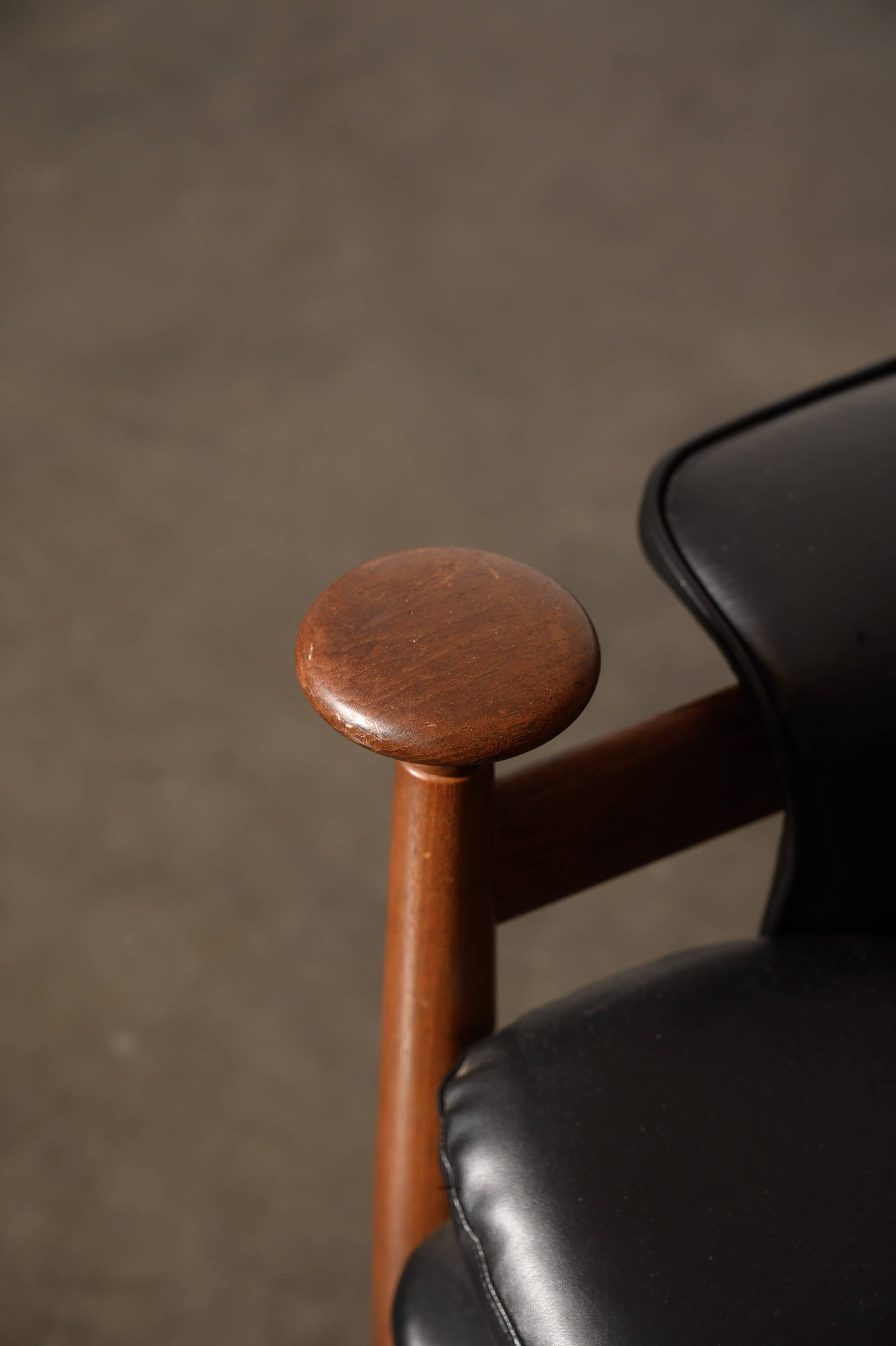 Finished Juhl armchair and its ottoman.