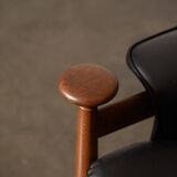 Finished Juhl armchair and its ottoman.