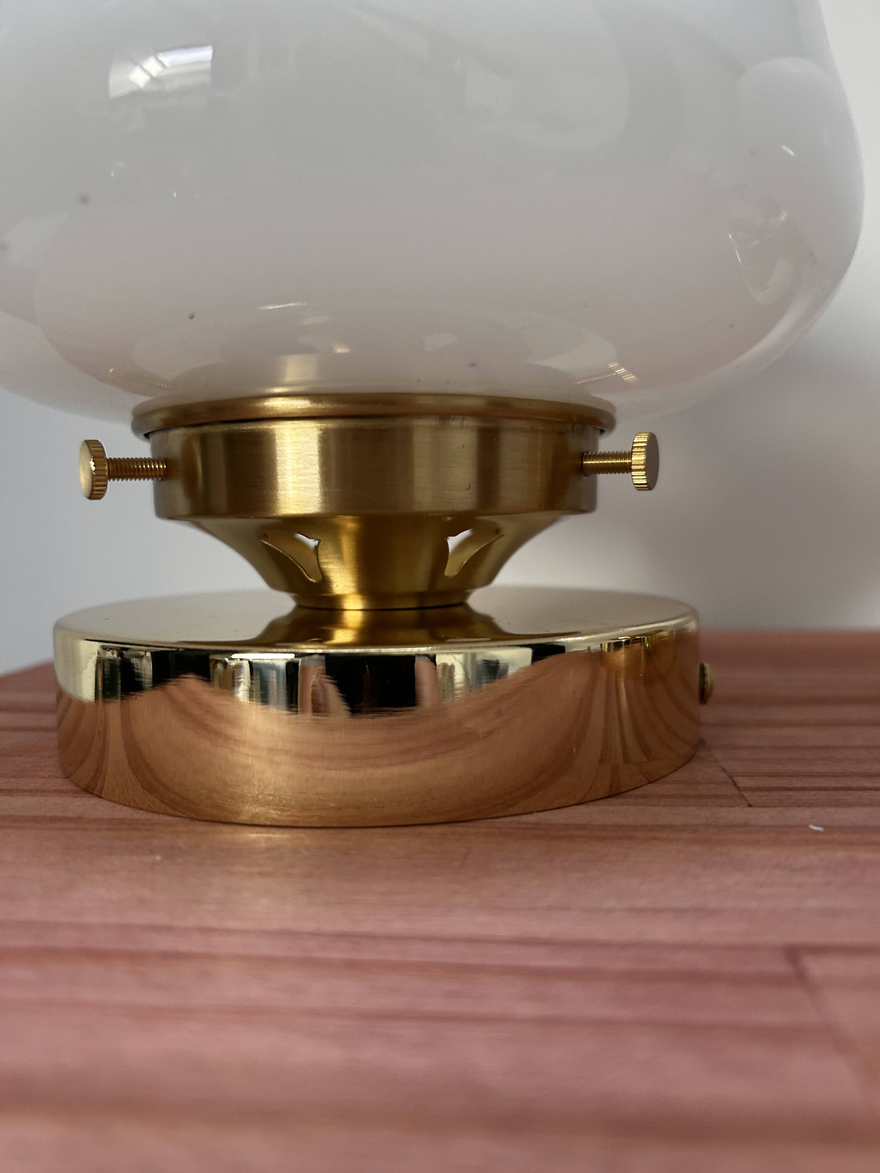 Pair of white opaline globe wall lights