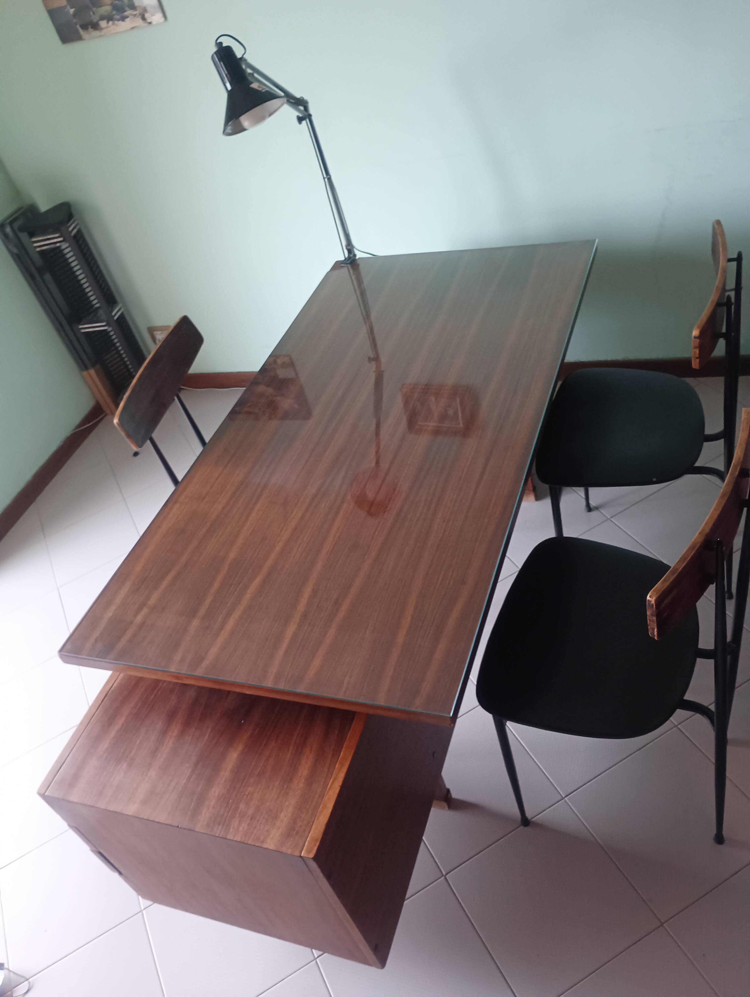 Desk and 3 chairs in 1950s Italian modernist style in rosewood.