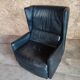Club armchair in leather by the brand Roset.