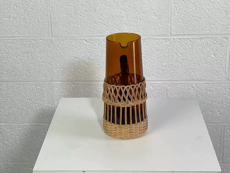 Vintage service for orangeade in amber glass and wicker.