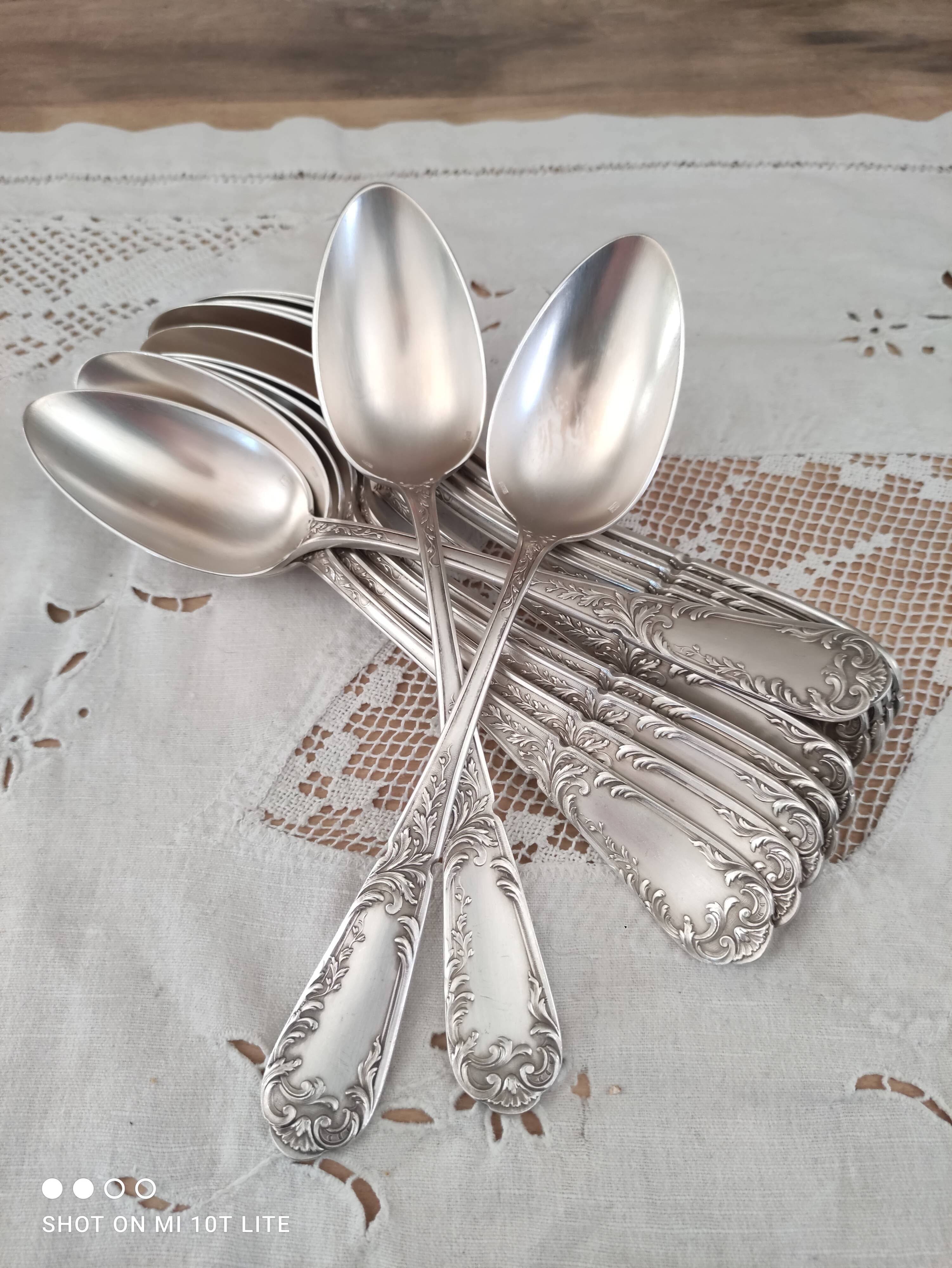 Set of 12 old silver-plated soup spoons