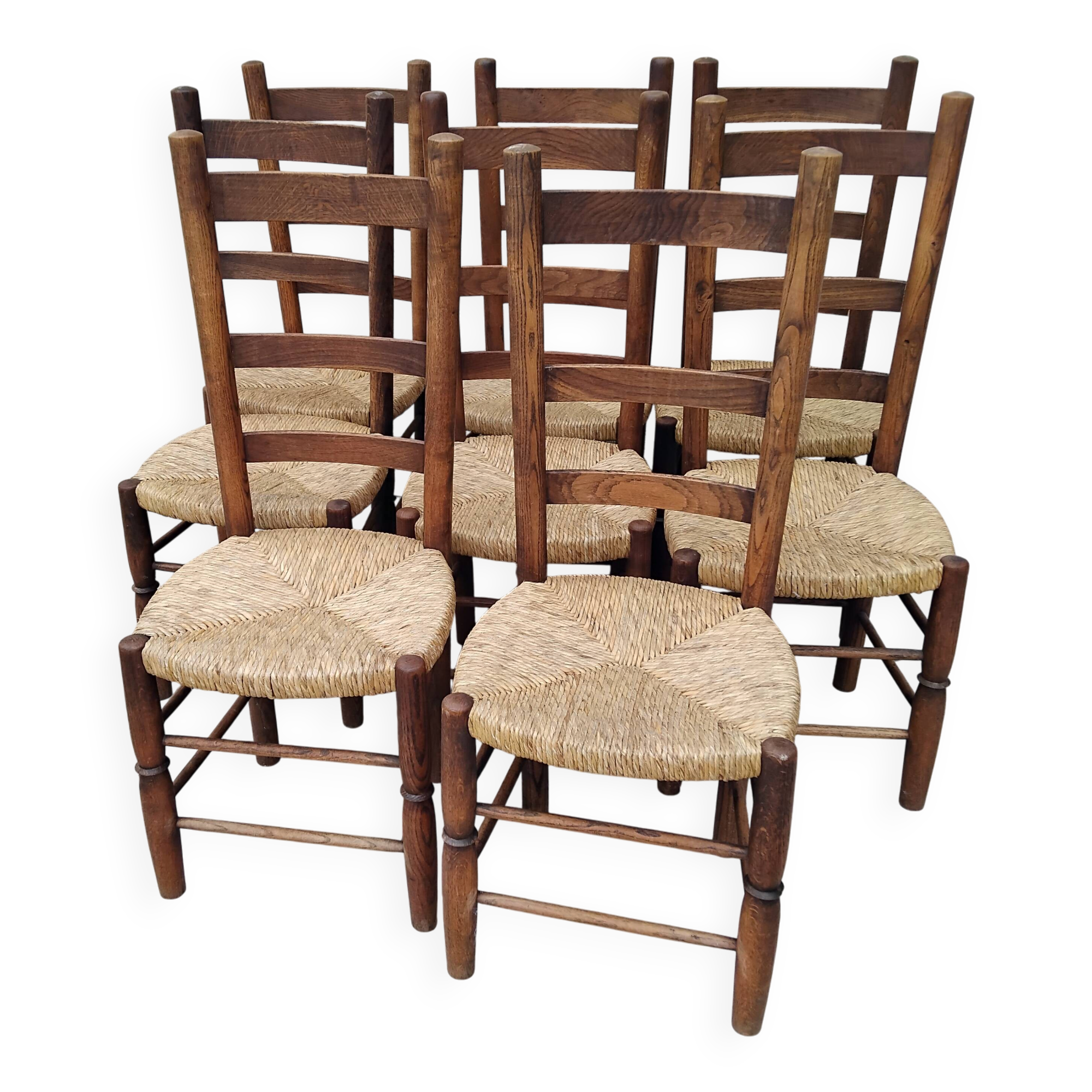 8 vintage straw chairs in the style of Charlotte Perriand.