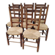 8 vintage straw chairs in the style of Charlotte Perriand.