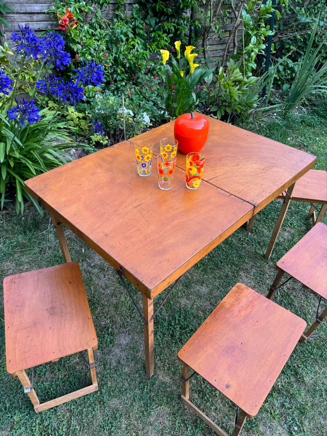 Old suitcase, table and stools, vintage wooden picnic