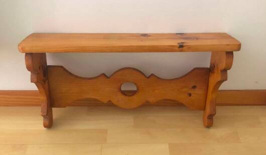 Rustic honey-colored varnished pine shelf