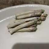 3 plates decorated with vegetables