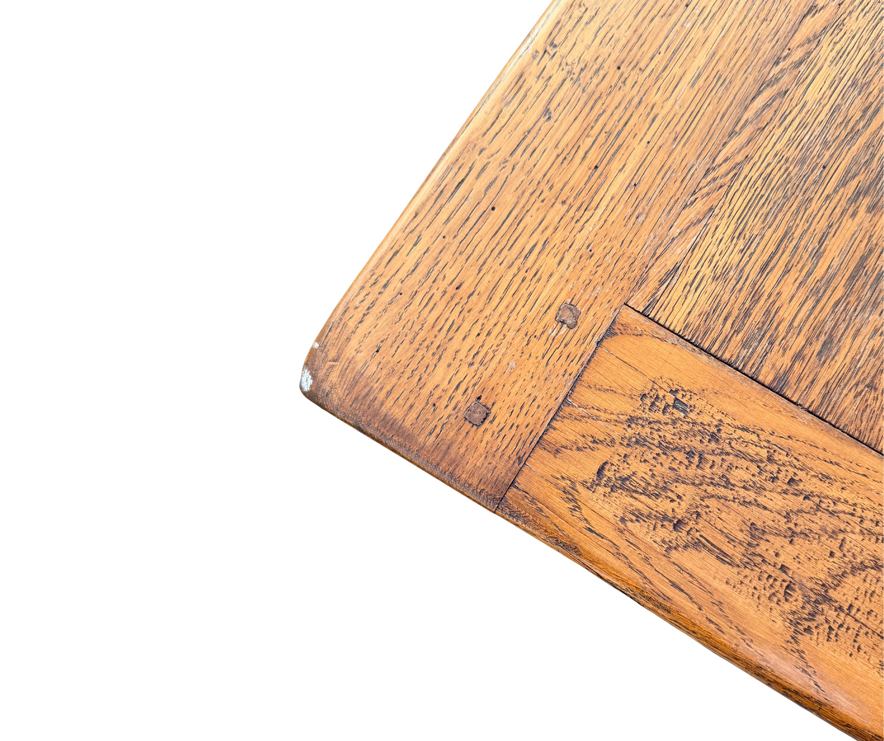 Large farmhouse table made of solid wood.