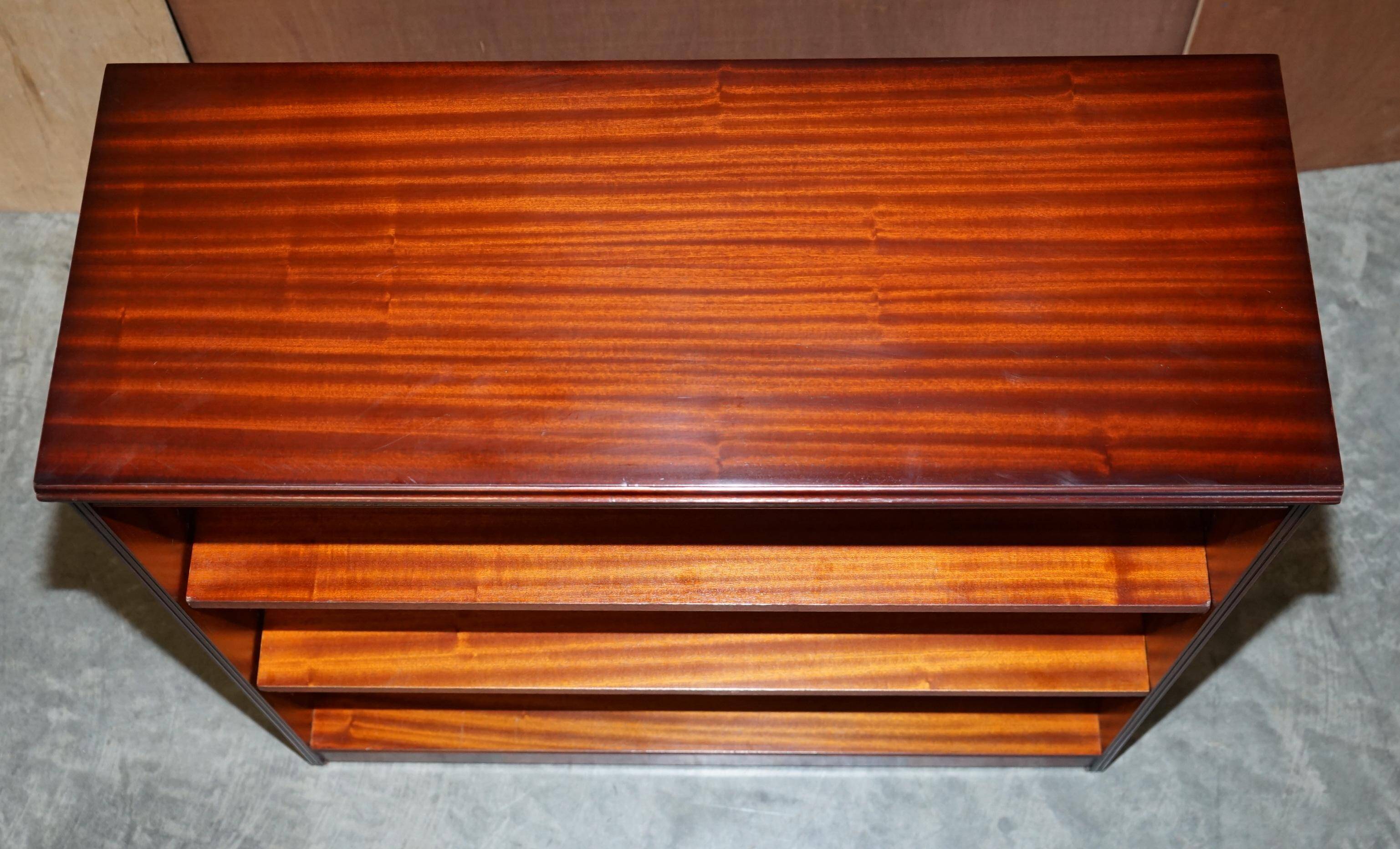 Pair of open low bookshelves Shaws of London in hardwood.