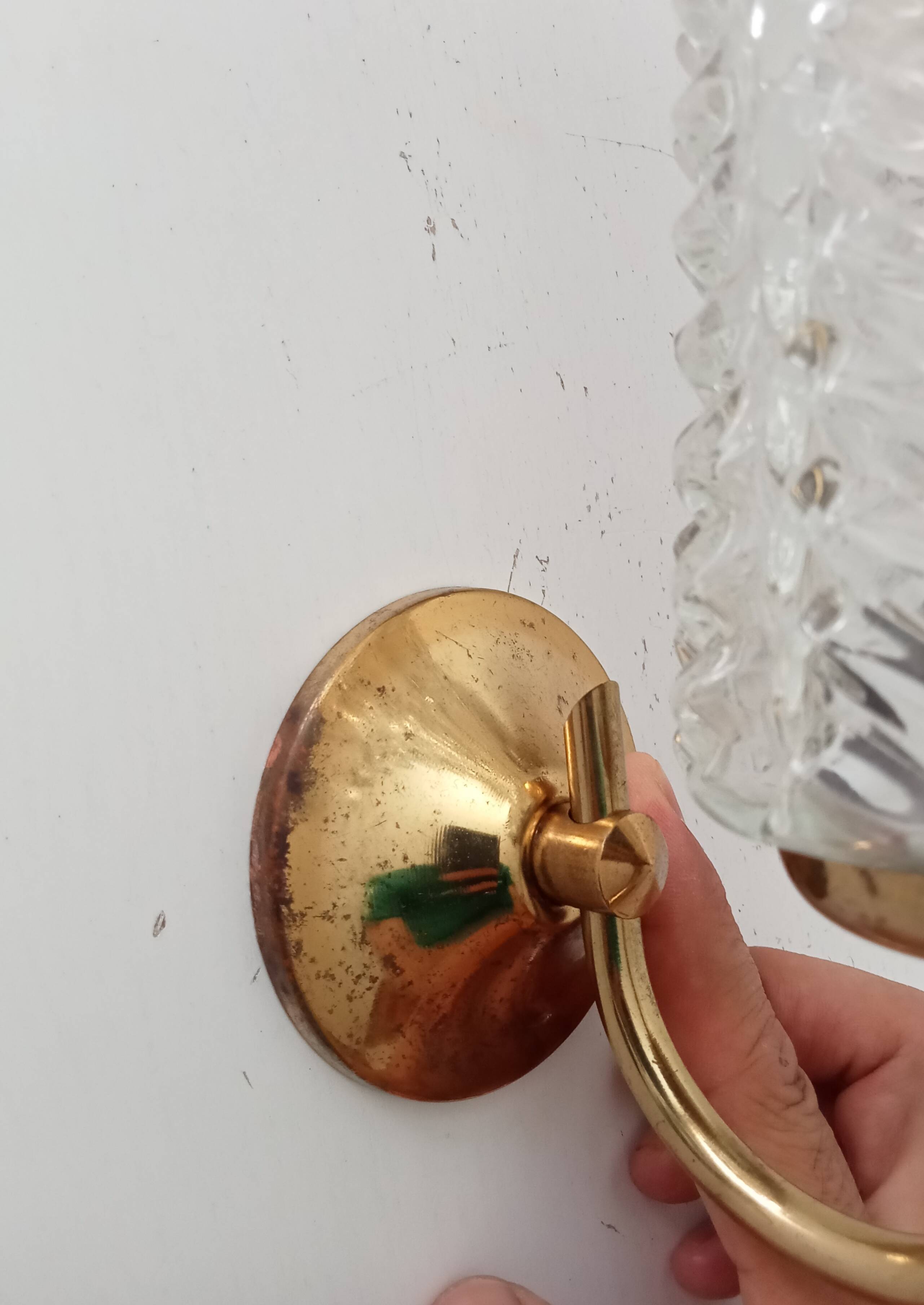 Vintage wall light in brass and etched glass.