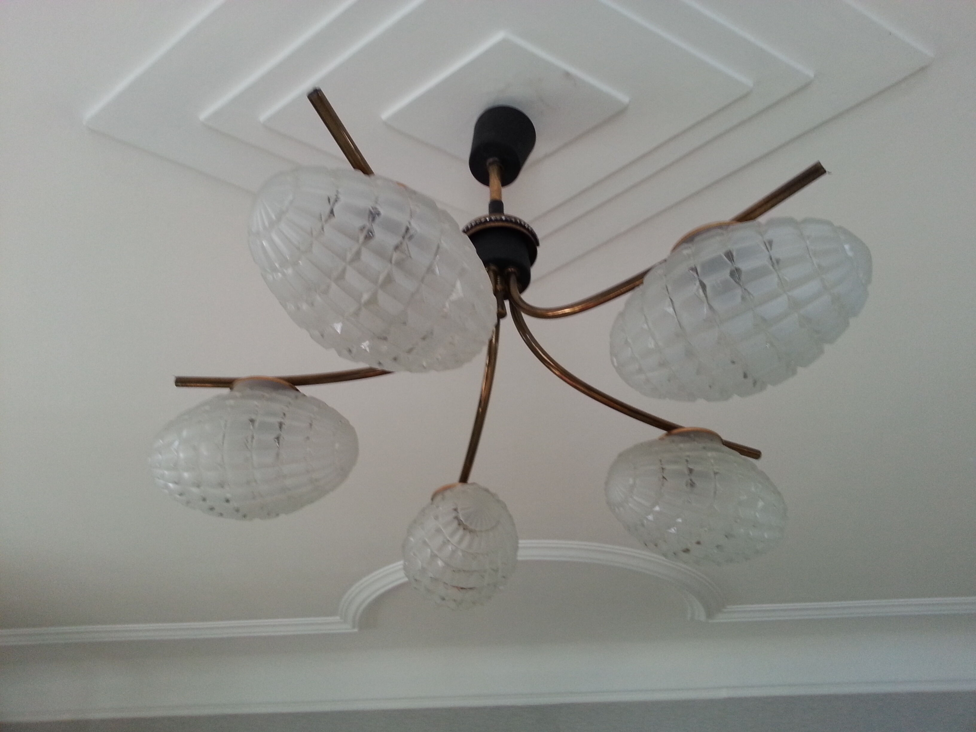Cosmic brass and chiseled glass chandelier