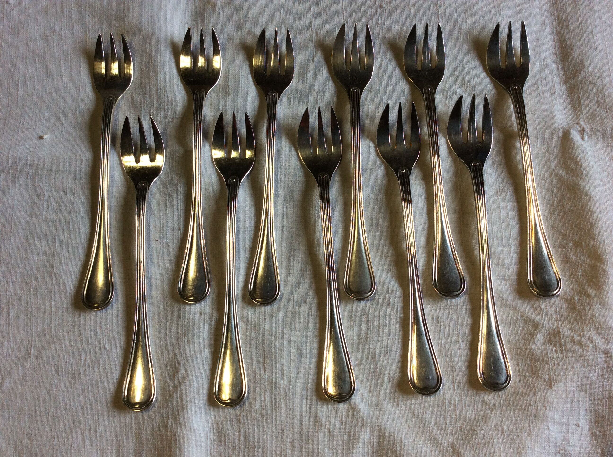 12 Christofle oyster forks in silver metal
