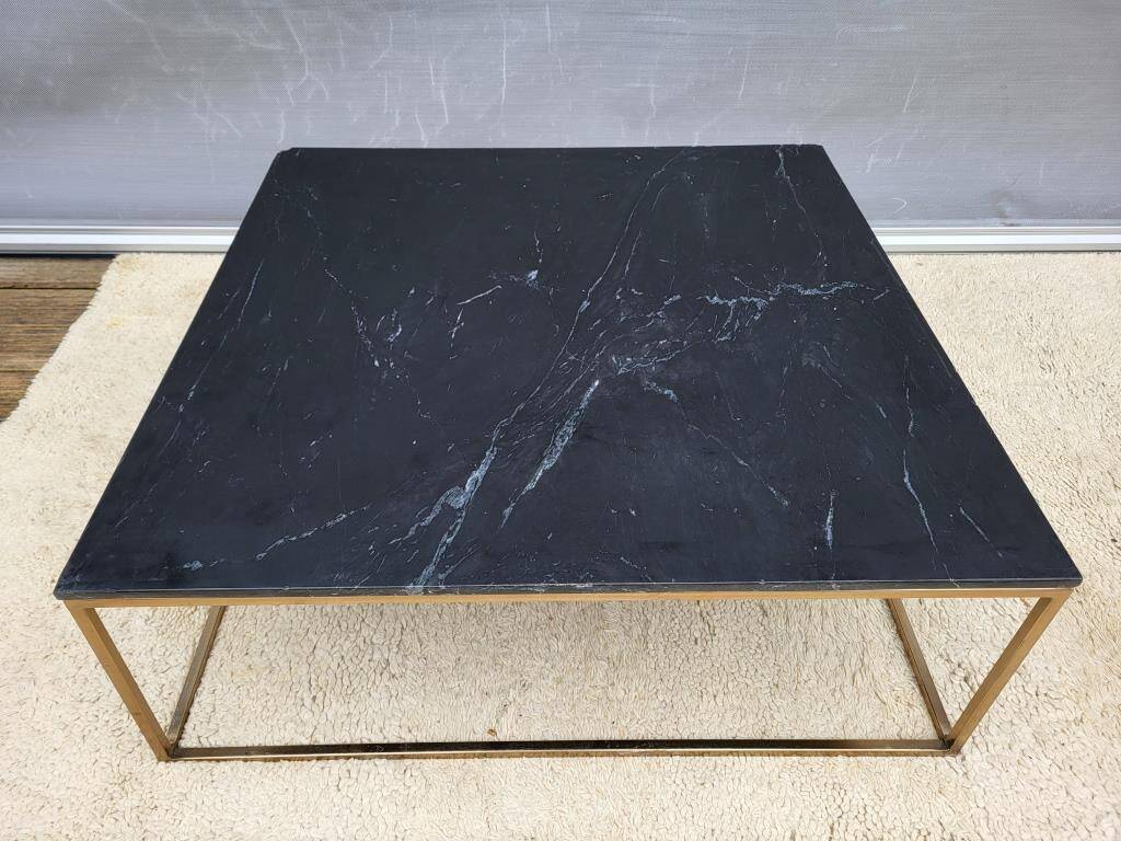Coffee table or black marble and brass display "in its own juice"