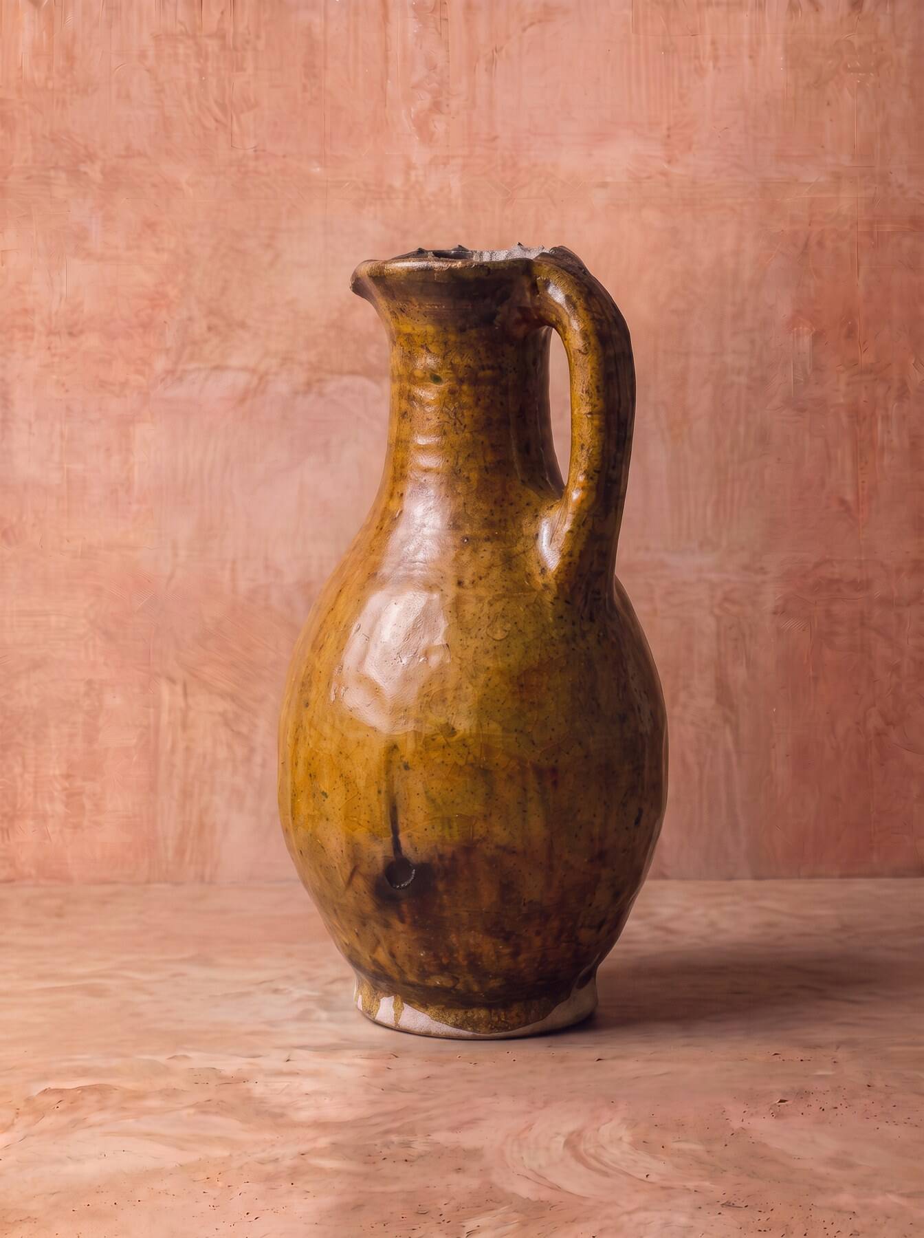 Glazed terracotta jug, rolled rim