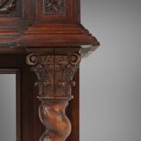 Richly decorated antique fireplace in oak, Belgium ca. 1920