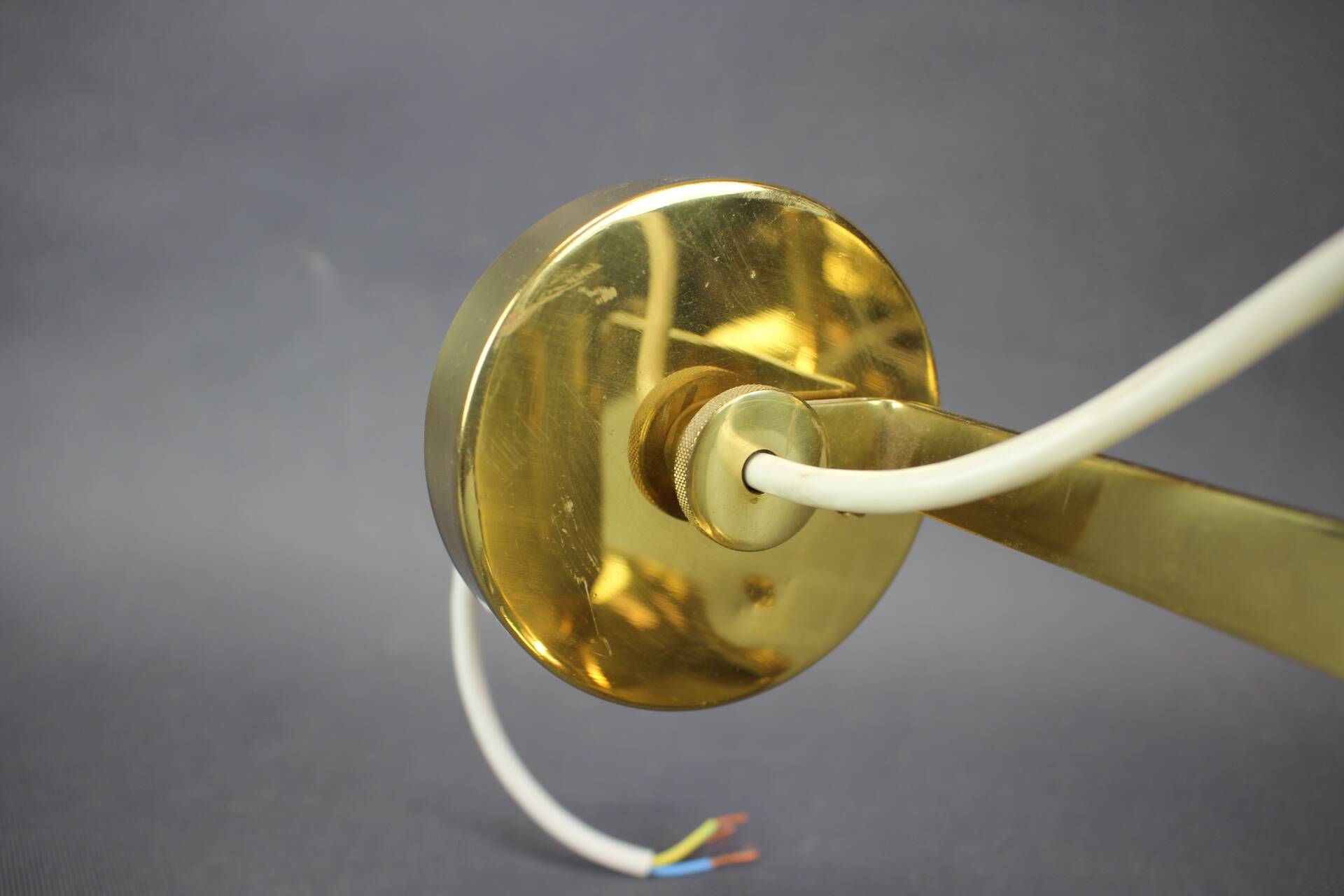Set of four adjustable brass wall lights, Germany, 1960s.
