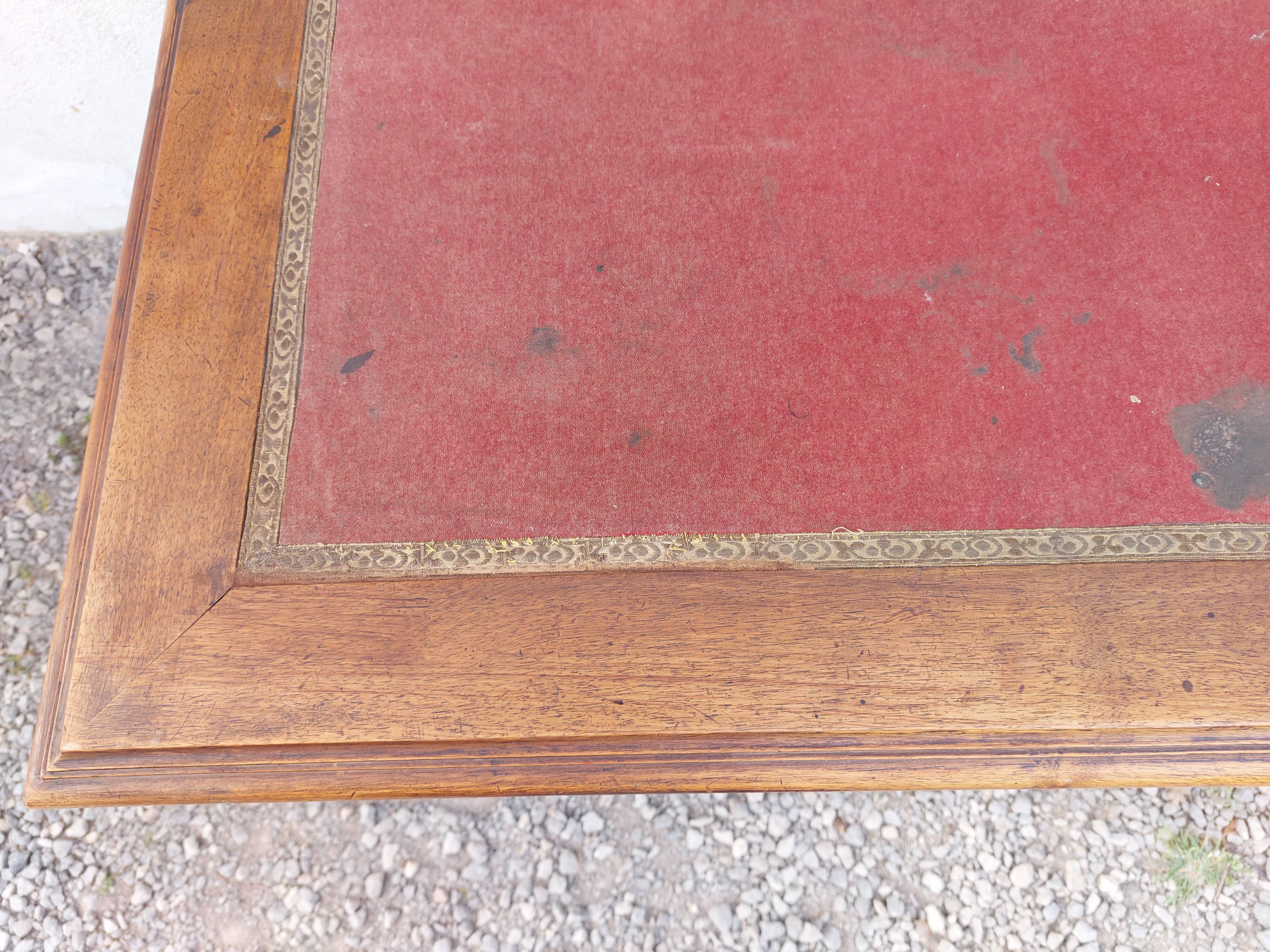 Old wooden desk, red felt top