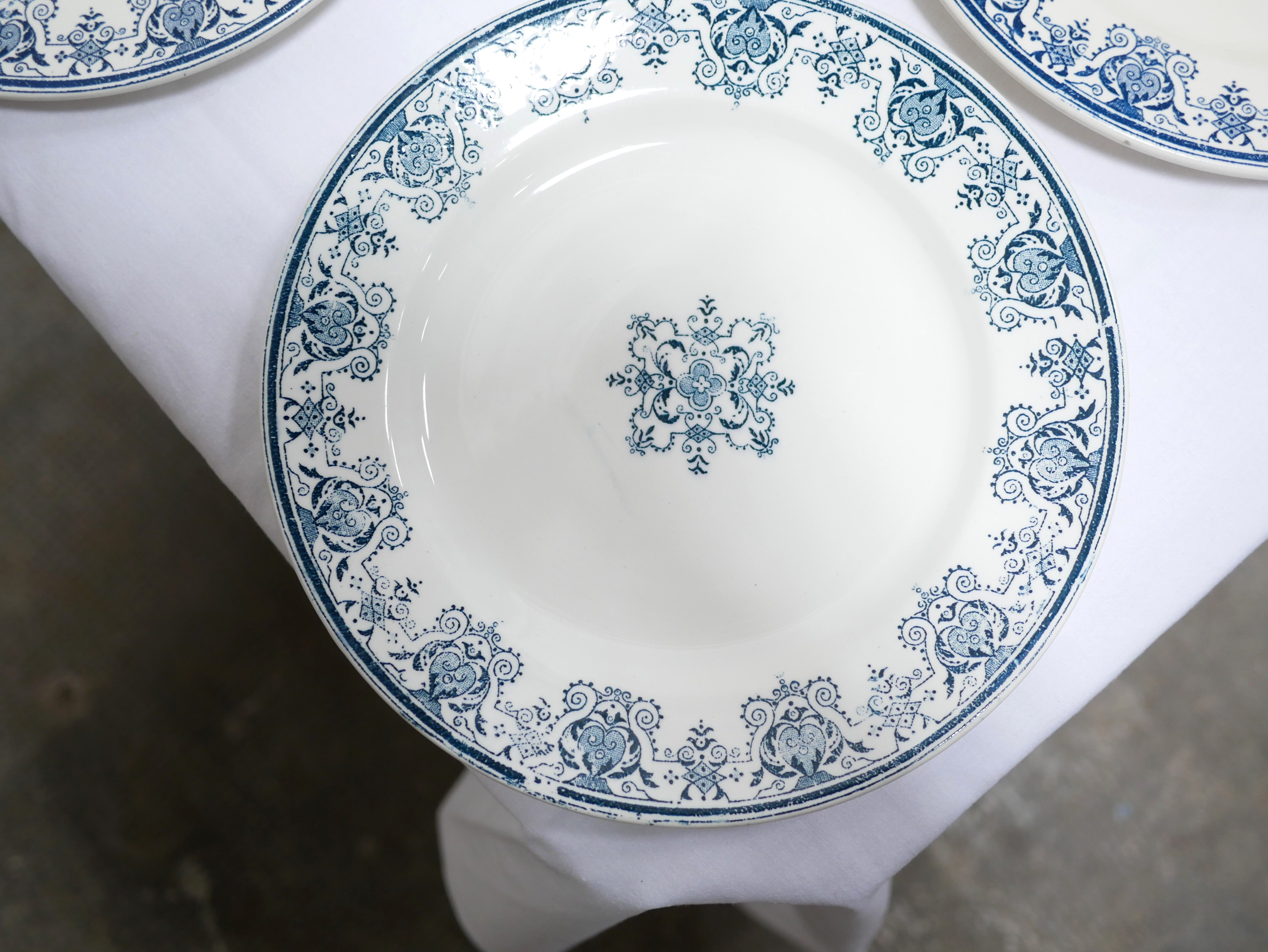 Series of 10 old Terre de Fer plates by L.G. for the earthenware factory of Clairefontaine