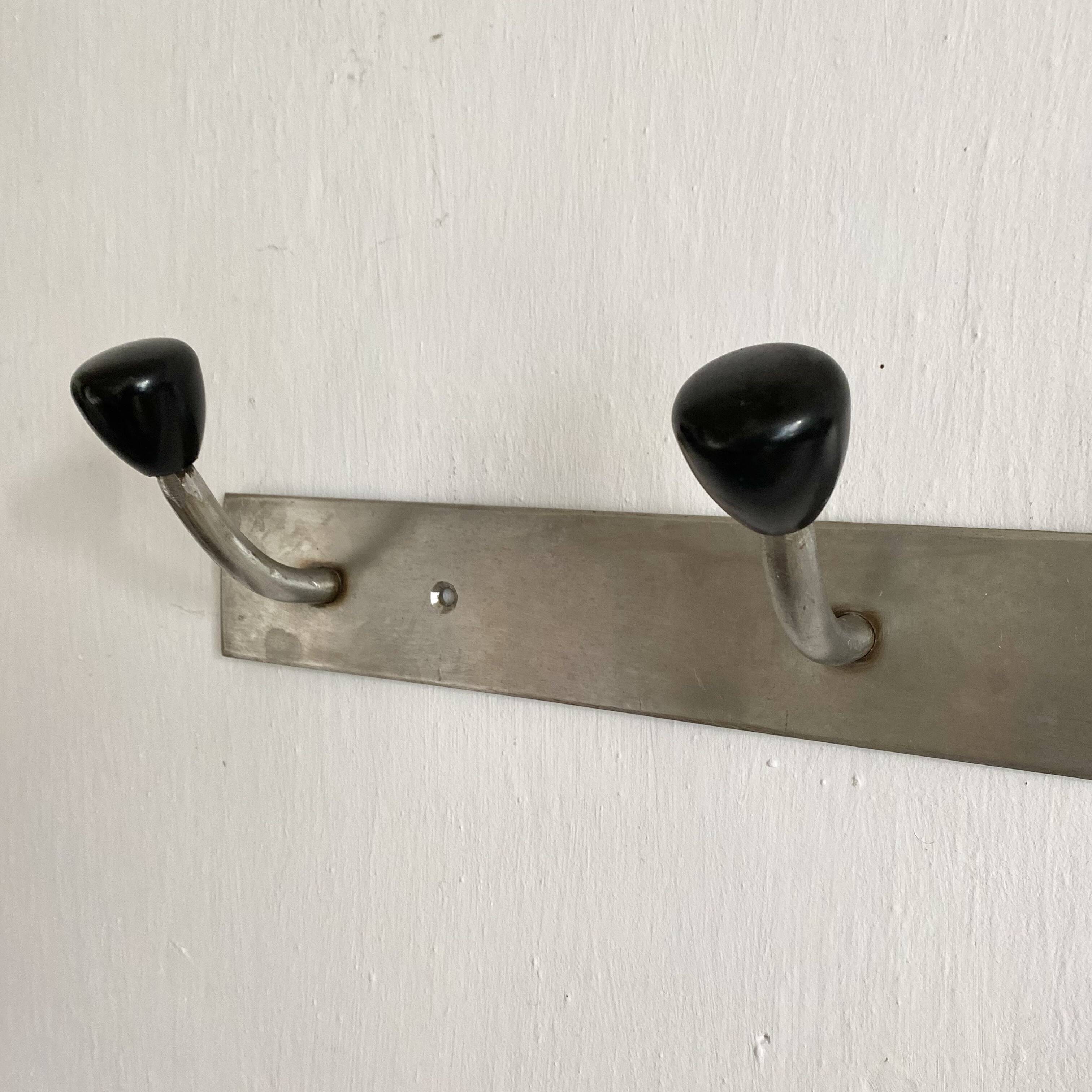 Industrial wall coat rack, 50s
