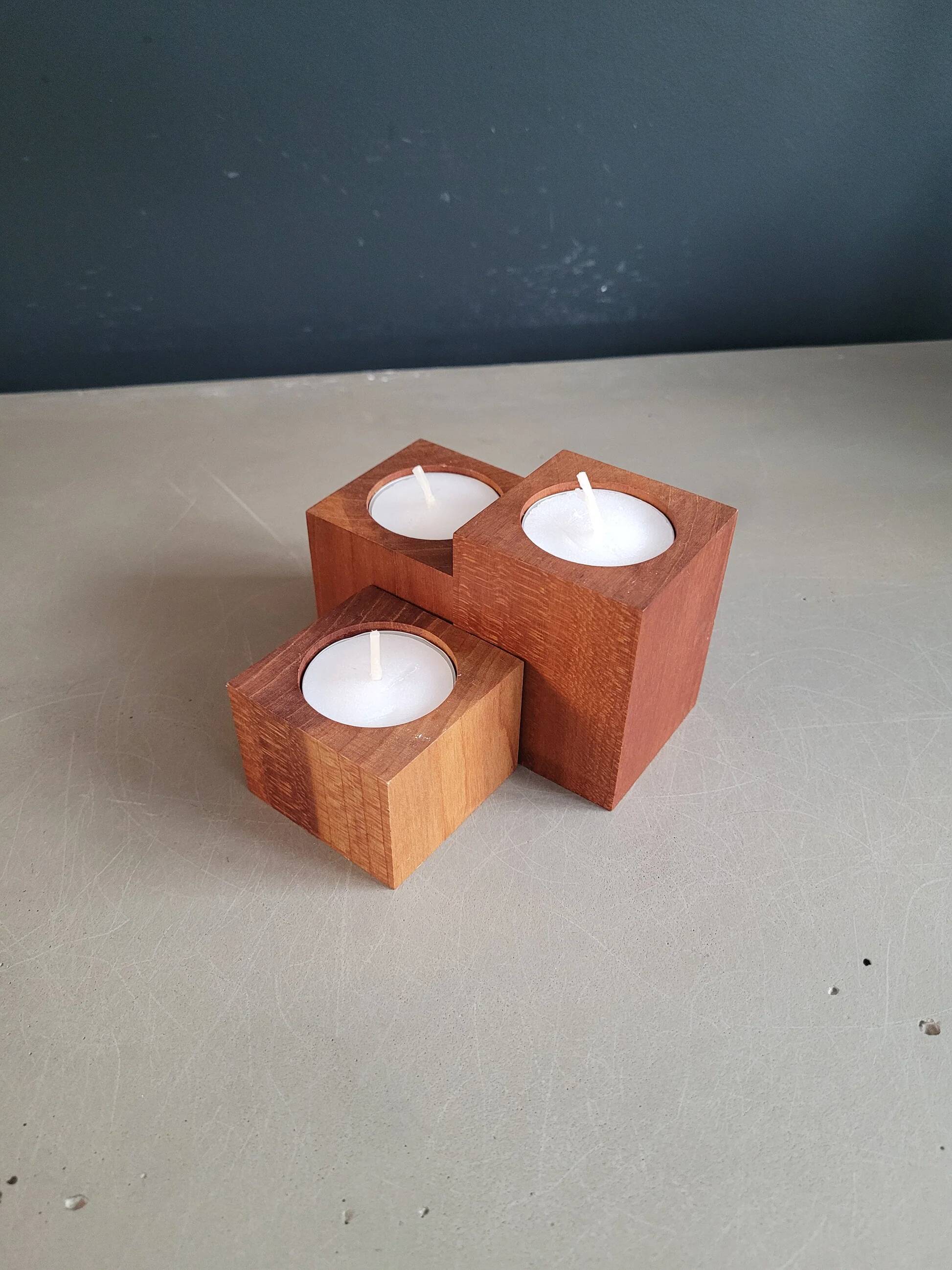 Vintage teak candlestick trio