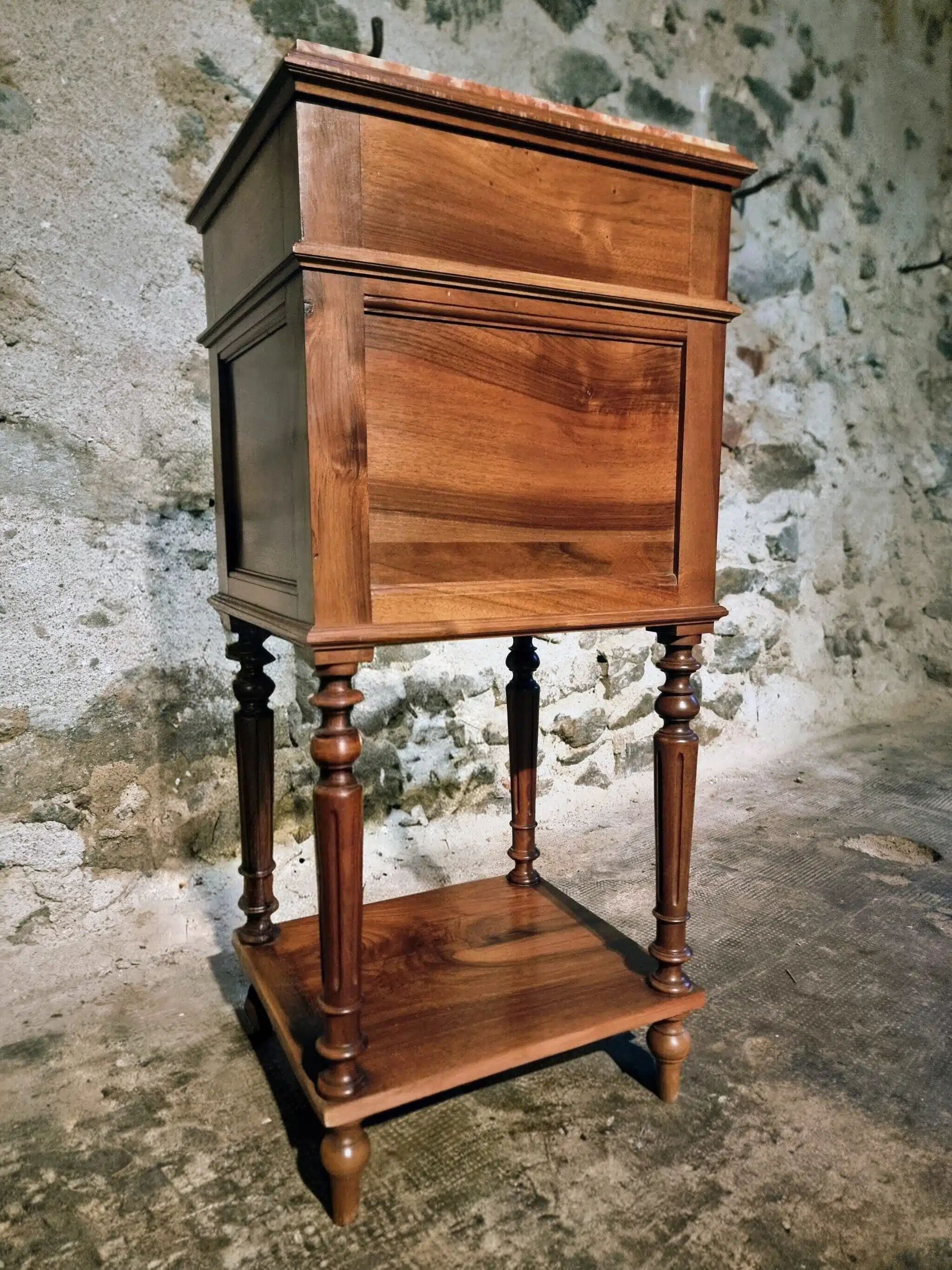 Antique French bedside table with a marble top.