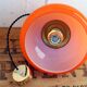 Suspension in orange opaline