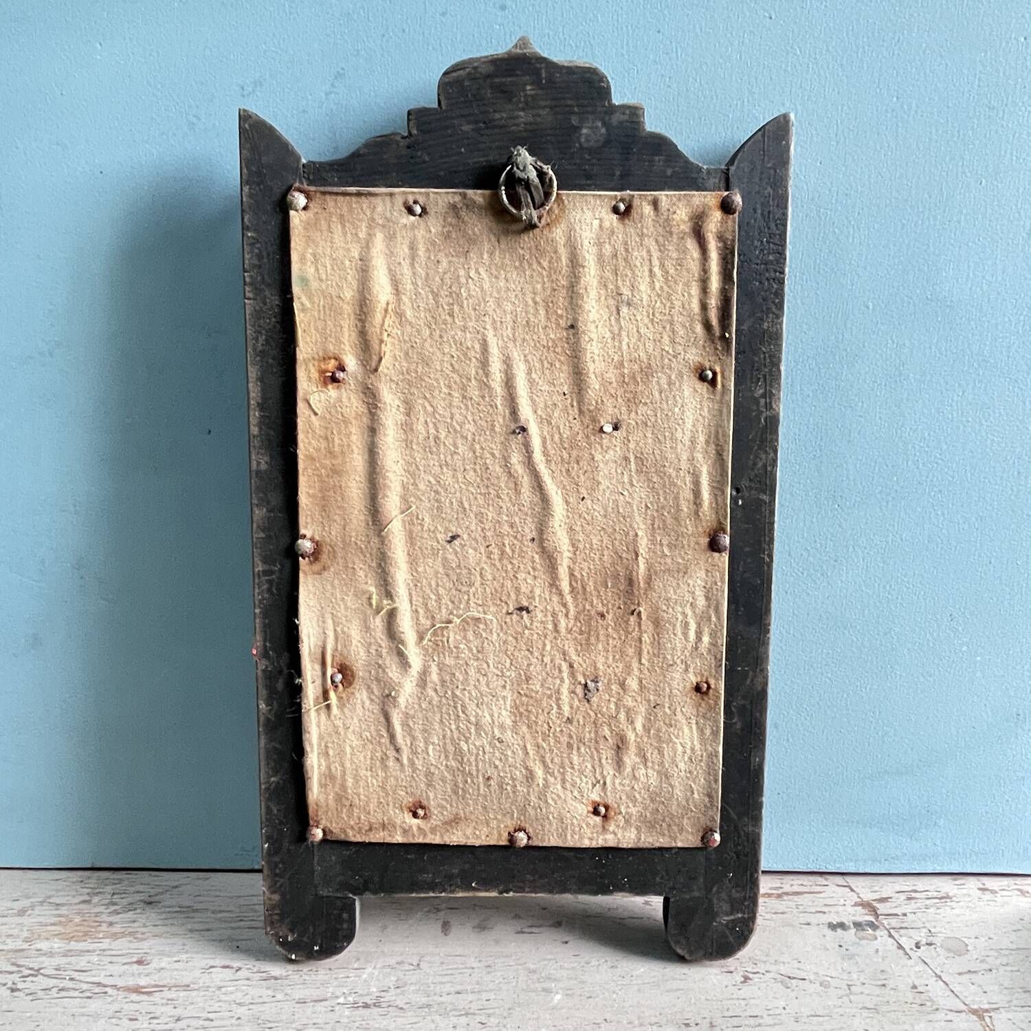 Antique wooden studded mirror