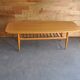 Vintage coffee table in maple and brown beech, surfboard style, with integrated magazine rack.