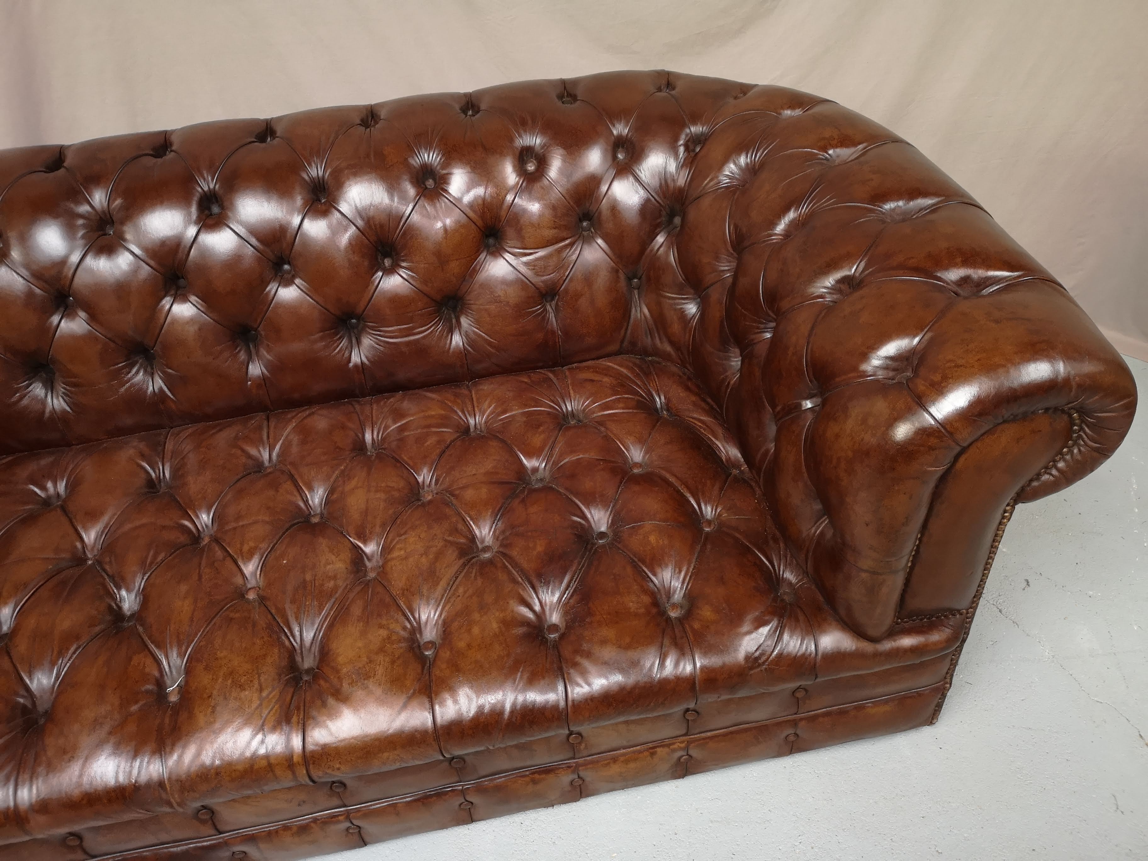 Upholstered chesterfield brown sofa