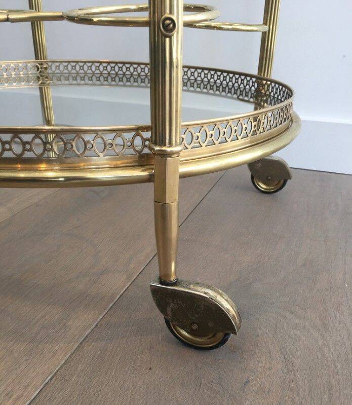 Round brass rolling table attributed to Maison Jansen