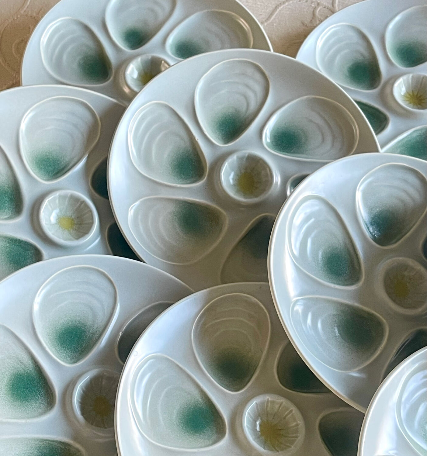 11 oyster plates 1960.