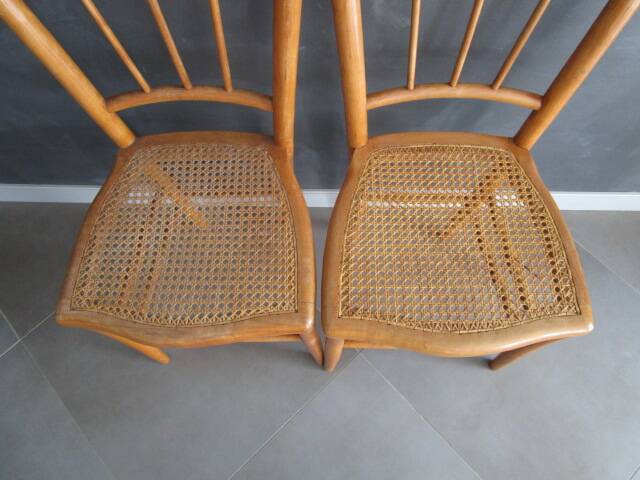 Pair of old caned chairs in blond wood