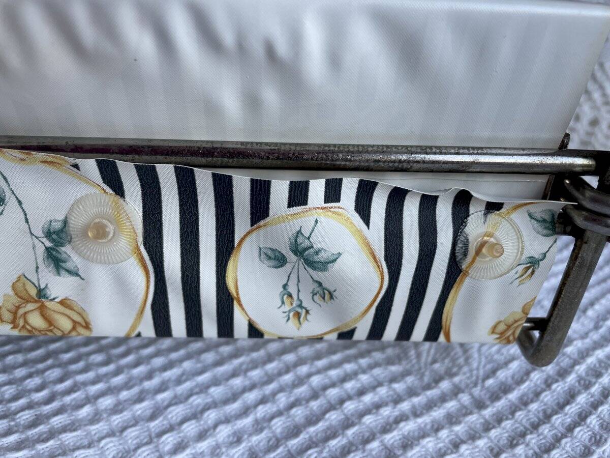 Vintage metal and plastic-coated fabric magazine rack