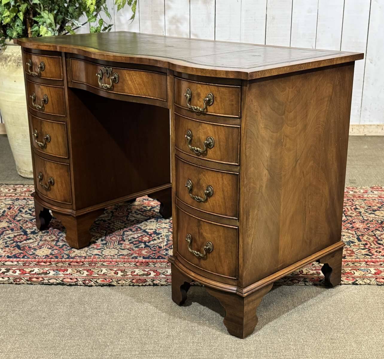 English desk from the 1950s in mahogany with a leather top.