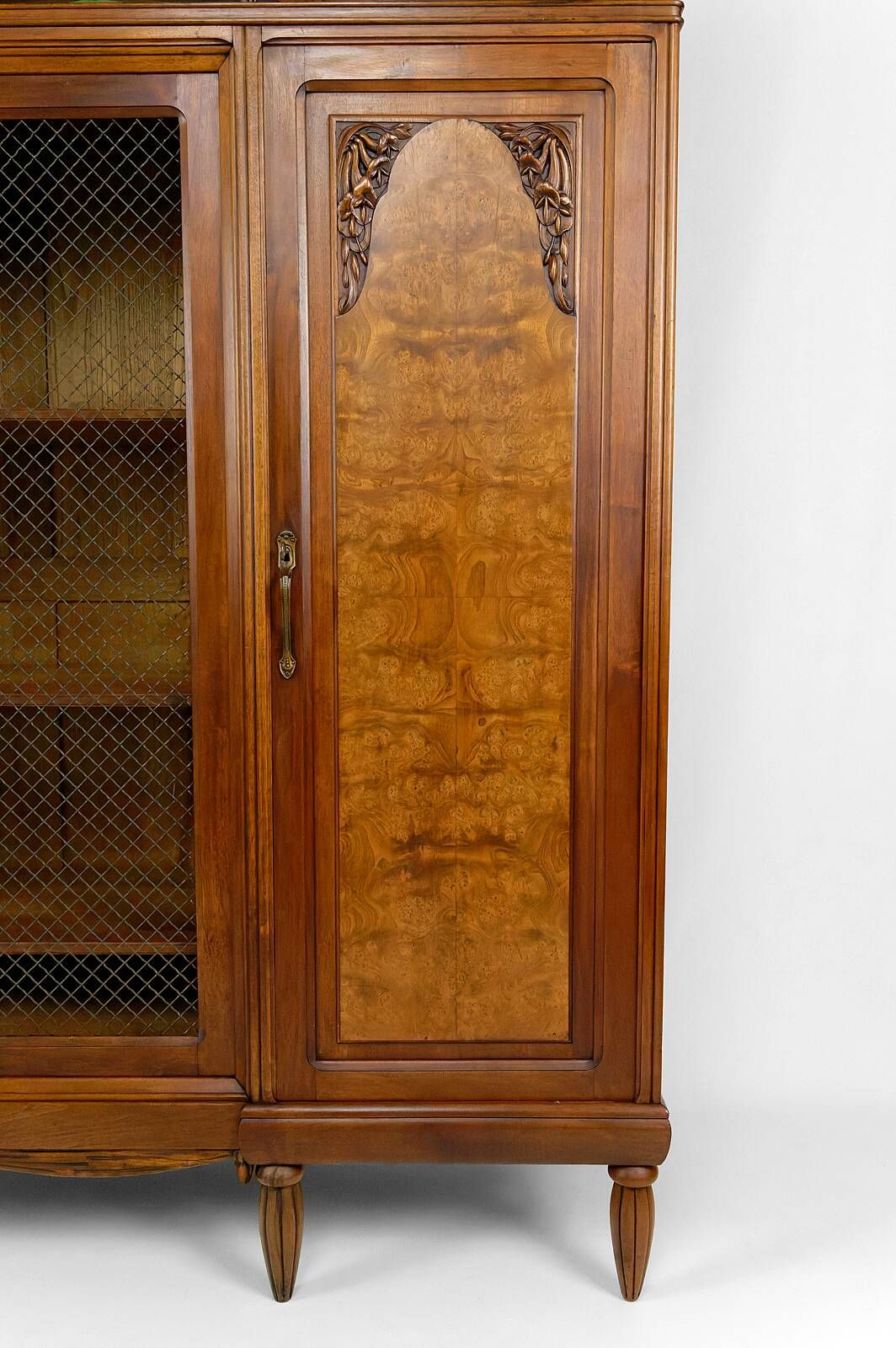 Art Deco showcase bookcase in carved walnut, France, circa 1925