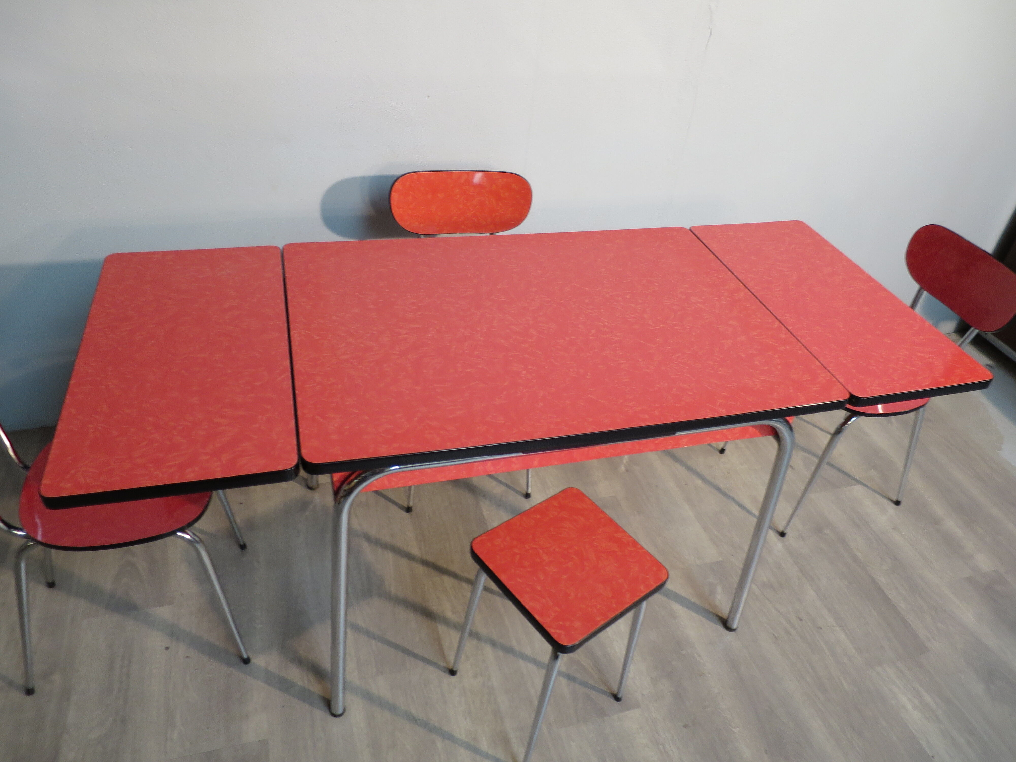 Table, 3 chairs and red formica stool