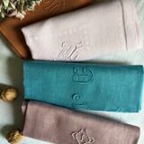 Set of four old damask towels tinted in multiple colors